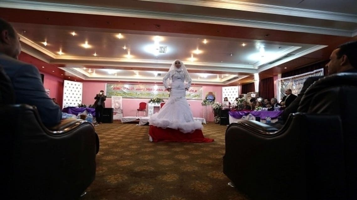 An Iraqi model walks on the cat walk during a show as part of a hairdressers and make up artists festival. (AFP)