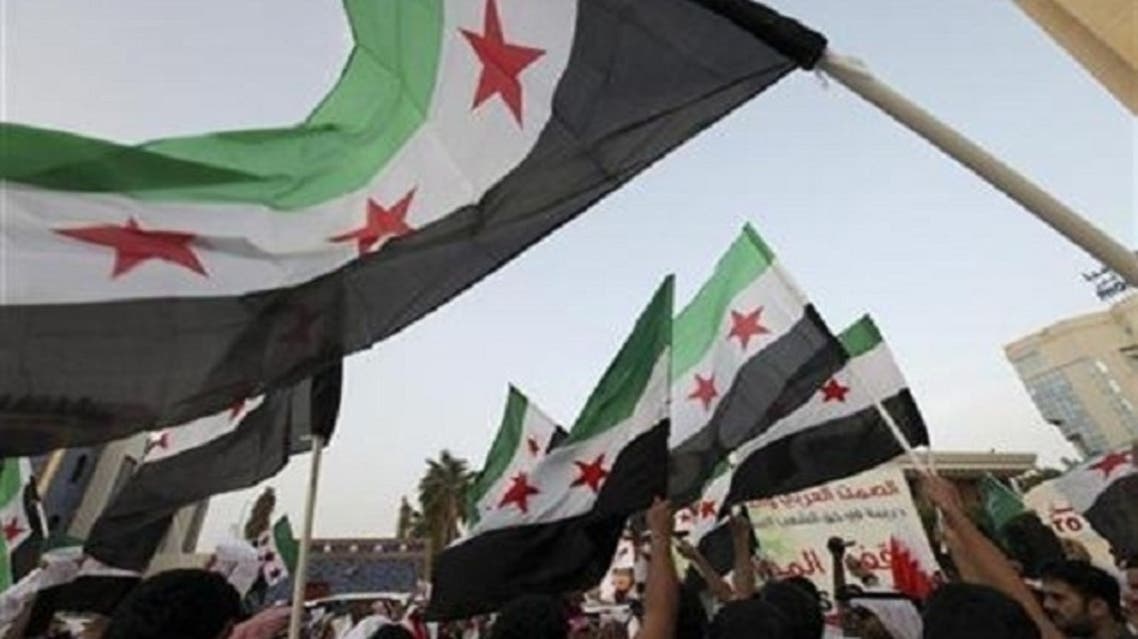“The flag of the revolution will be raised above the building,” the Syrian National Coalition added. (Reuters)