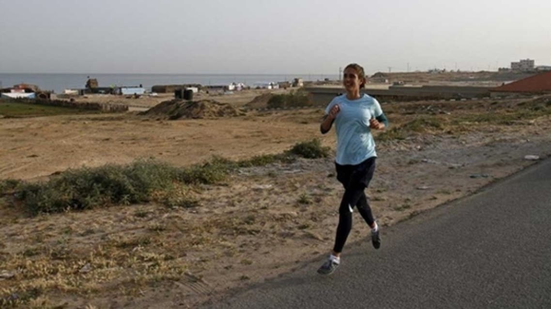 UNRWA (United Nations Relief and Works Agency for Palestine refugees) staffer Gemma Connell runs in Beit Hanun on May 5, 2011 as she competes in the Gaza Strips first-ever marathon which runs the entire length of the coastal enclave. (AFP)