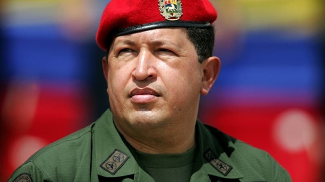 Venezuela’s President Hugo Chavez wears an army uniform and the red beret of his parachute regiment while attending a military parade in Caracas in this April 13, 2005 file photo. (Reuters)