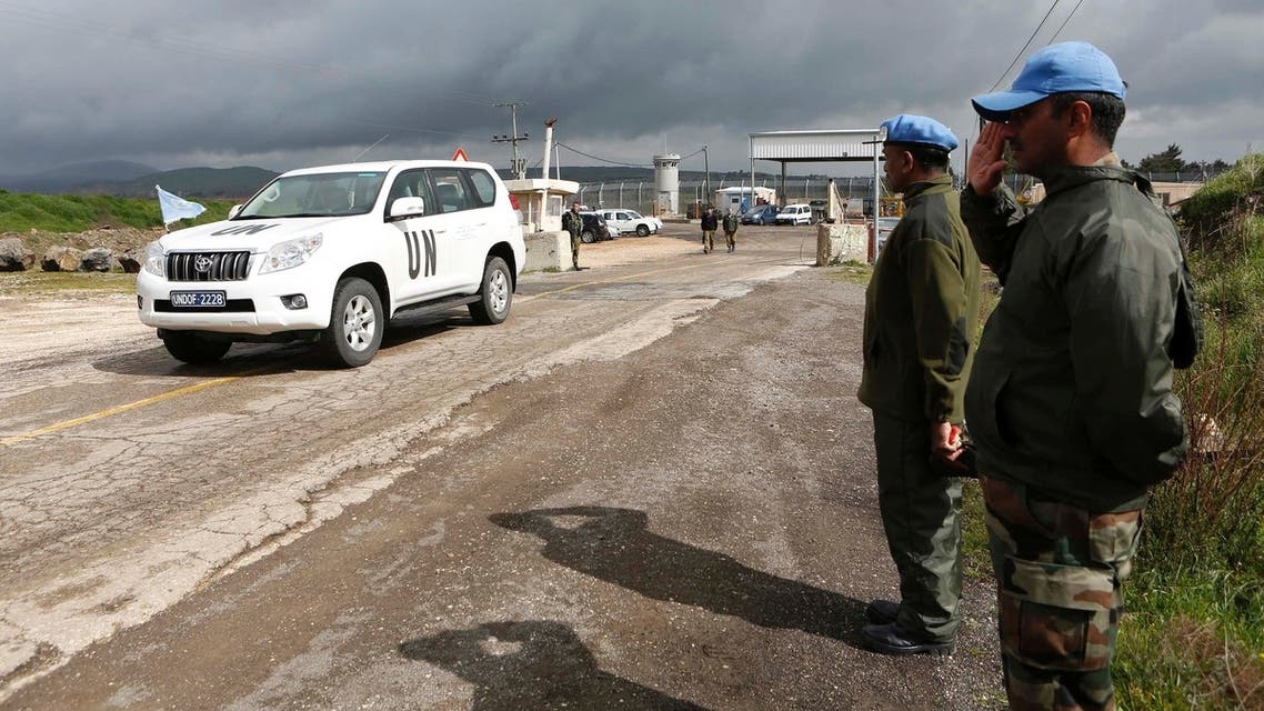 India’s United Nations peacekeepers salute as a U.N. vehicle crosses from Syria into Israel at the Kuneitra border crossing on the Golan Heights March 5, 2013. (Reuters)