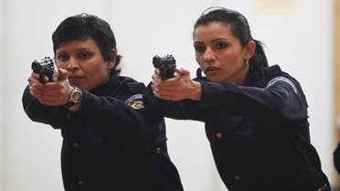Algerian policewomen are brushing up on their shooting skills at a police training academy in Algiers. (Reuters)