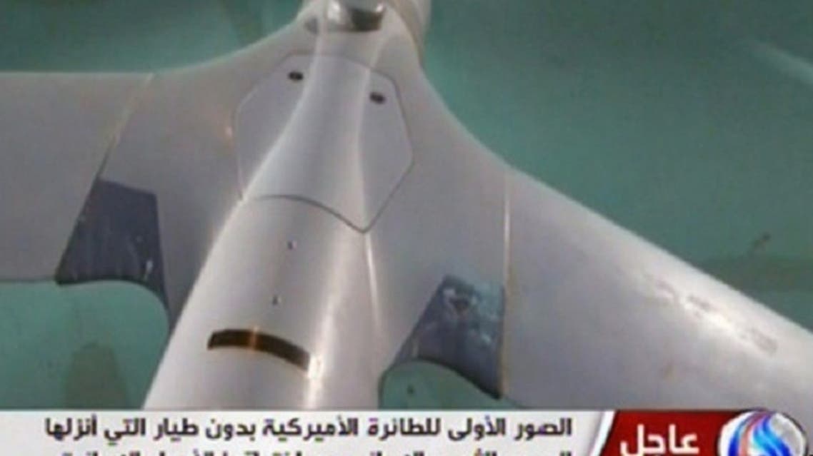 In this image taken from the Iranian state TV's Arabic-language channel Al-Alam, showed what they purport to be an intact ScanEagle drone aircraft put on display, as an exclusive broadcast Tuesday Dec. 4, 2012, showing what they said were the first pictures of a captured drone. (AP Photo / Al-Alam TV)
