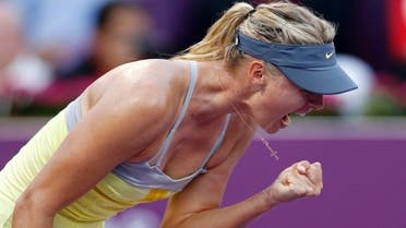 Maria Sharapova of Russia reacts as she celebrates a point against Samantha Stosur of Australia during their women's quarter-final match at the Qatar Open tennis tournament in Doha February 15, 2013. (Reuters)