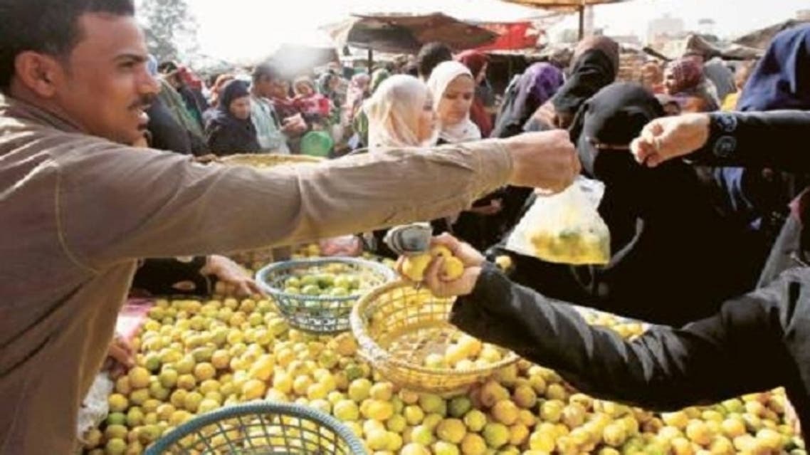 People shop at a market in Cairo. According to the statistics agency CAPMAS, Egypt’s urban consumer inflation shot up to 8.2 percent in the 12 months to February as a sliding Egyptian pound pushed up food prices. (Reuters)
