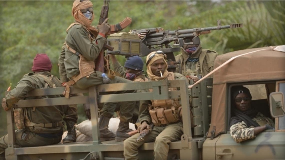 Malian soldiers patrol a street in Diabaly, Jan. 26, 2013. French-led Malian troops recaptured the Islamist stronghold of Gao, the biggest town in northern Mali, and troops from Niger and Chad “will now take up the baton,” the French defense ministry said. (AFP)