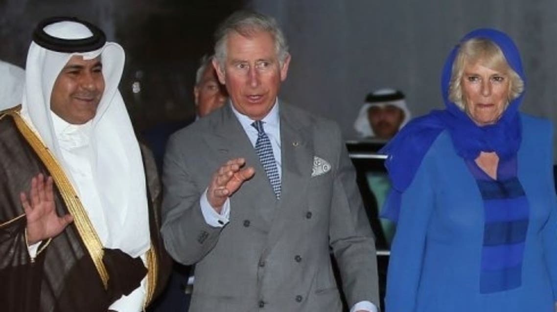 Qatar's Sheikh Abdul Rahman Bin Saud Al Thani (L) escorts Prince Charles (C) and Camilla in Doha on March 13, 2013 (AFP)
