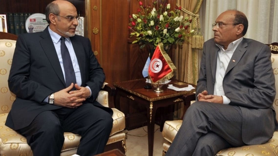 Tunisian Prime minister Hamadi jebali (L) arrives to submit his resignation to Tunisian President Moncef Marzouki on Feb. 19, 2013. (AFP)