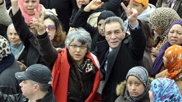 Basma Khalfaoui Belaid (C-L), the widow of assassinated Tunisian opposition leader Chokri Belaid, flashing the sign for victory during the funeral procession of her late husband, as she walked to the nearby cemetery of El-Jellaz where Belaid was buried. (AFP)