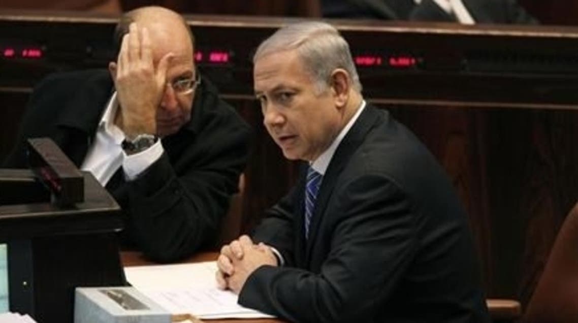 Israel's Prime Minister Benjamin Netanyahu (R) sits next to Vice Prime Minister Moshe Yaalon during a memorial service for the late Israeli Tourism Minister Rehavam Zeevi at the Knesset, the Israeli parliament, in Jerusalem November 2, 2011. (Reuters)