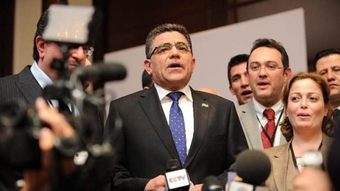 Ghassan Hitto (C) speaks to the press after being elected as the prime minister of the interim government of Syria's opposition, in Istanbul, Turkey, March 19, 2013. (Courtesy: Xinhua)