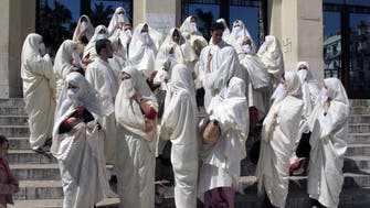 Algerian women march in white to defend tradition