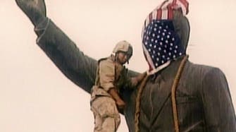 سر الاتصال الذي أدى لإنزال علم أمريكا من رأس تمثال صدام