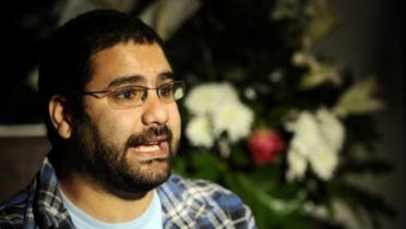 Egyptian blogger and activist Alaa Abdel Fattah speaks during a TV interview at his house in Cairo. (AFP)