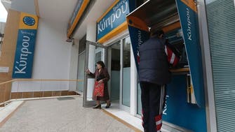 Cyprus eases controls on stricken banks