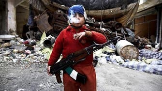 A seven-year-old boy takes up arms against Assad