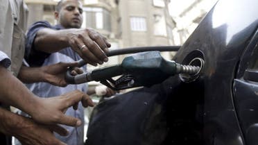 A worker fills the tank of a car at a petro station in Cairo. Power cuts in Egypt are due to a shortage of funds to buy fuel for power stations (Reuters)