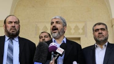 Hamas chief Khaled Meshaal (C) and members of Hamas’ political bureau, Mohammed Nazzal (L) and Mohammed Nasser (R) speak to reporters following their meeting in Amman. (AFP)