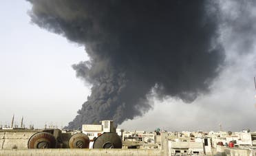 An undated photo shows black smoke rising from Homs refinery. (File photo: Reuters)