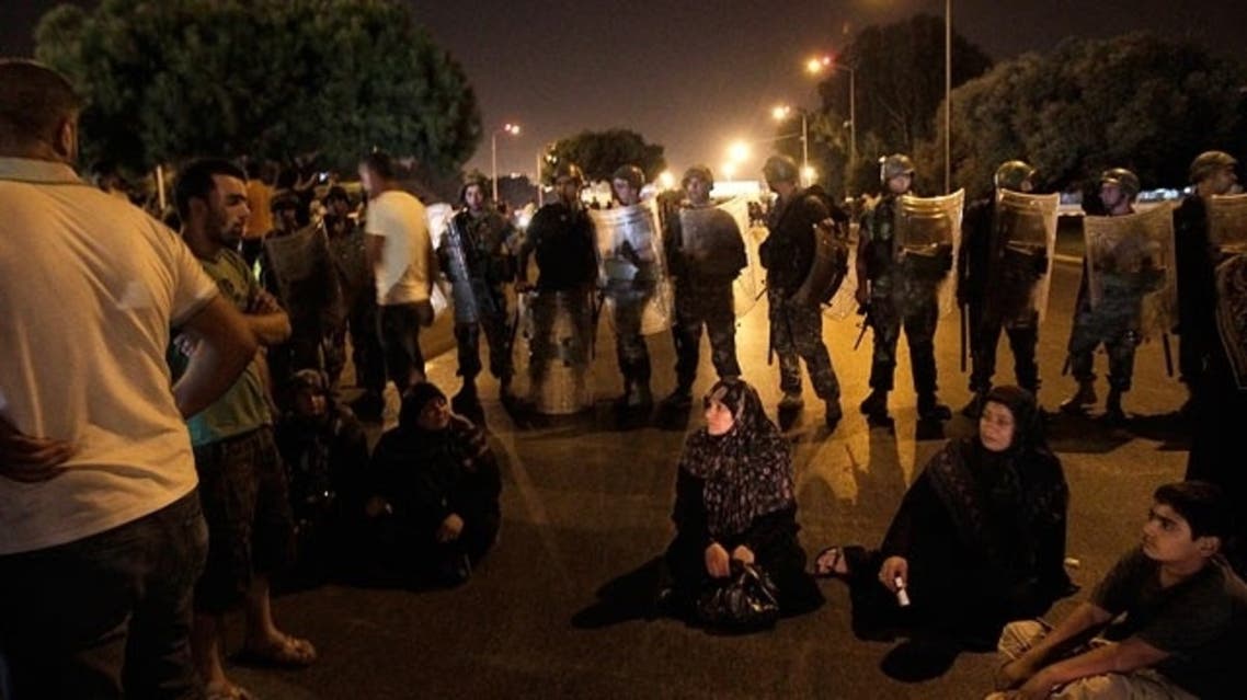 Relatives of Lebanese held in Syria block workers