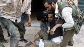 At least 61 die in shelling, executions in Syrian town: activists
