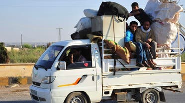 Syria men flee (Reuters)