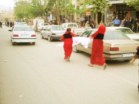 Pictures showing Kurdish activists wearing their traditional red costumes. (Photo courtesy NNSROJ news agency)
