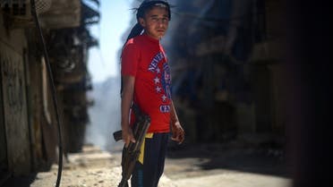 Syria AFP child with gun