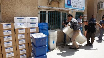 Bombs near polling centers mar first Iraq vote since U.S. exit