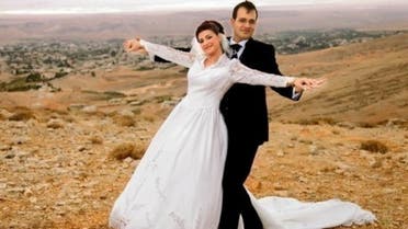 Kholoud Sukkariyeh (L) and Nidal Darwish pose for a photograph during a photoshoot at an undisclosed location (Darwish Family/AFP/file)