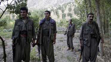 PKK fighters stand near the Qandil mountains near the Iraq-Turkish border. —Reuters