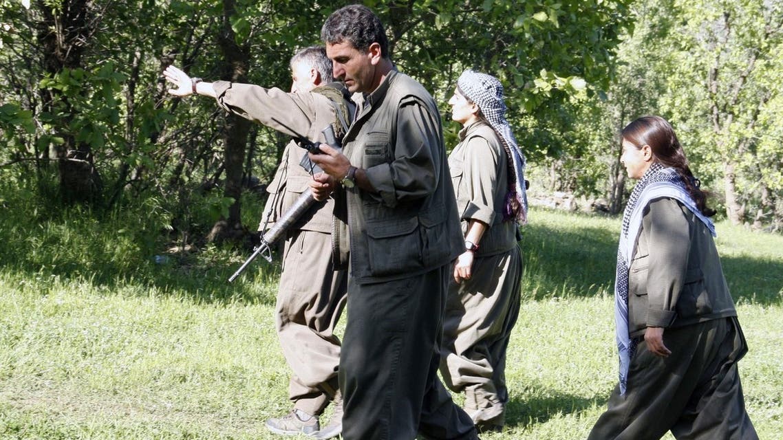 Kurdistan Workers' Party (PKK) rebels walk as they gather to listen to the speech of the PKK leader on April 25, 2013 in the Qandil mountain. (AFP)