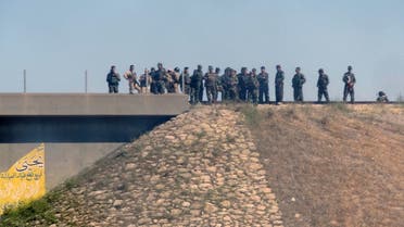 Kurdish security forces, called the Peshmerga, stand on the top of a hill on April 27, 2013 outside northern Iraqi city of Kirkuk. (AFP)