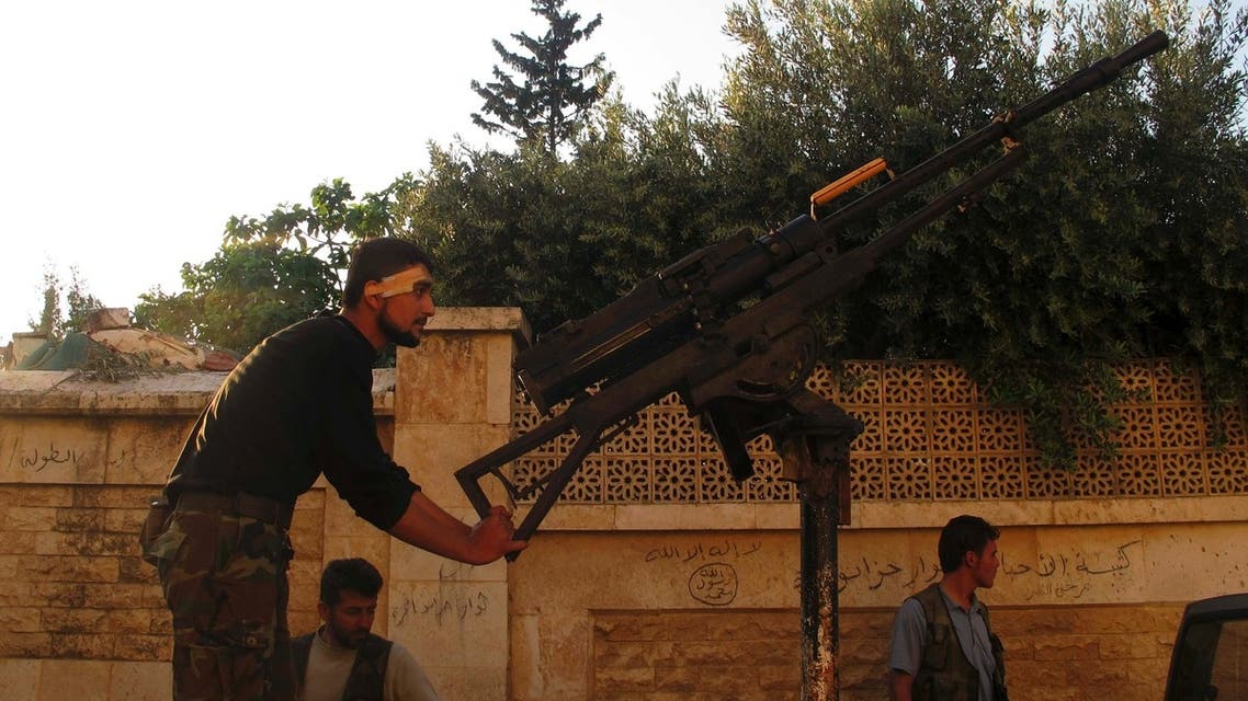 A Free Syrian Army fighter holds onto an anti-aircraft weapon in the Khan al-Assal area, near Aleppo April 27, 2013. (Reuters)