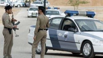 Saudi police arrest two wanted men after gunfight