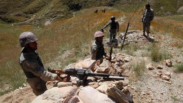 Afghan border policemen take their positions at the Goshta district of Nangarhar province border, where Afghanistan shares borders with Pakistan, May 2, 2013. (Reuters)