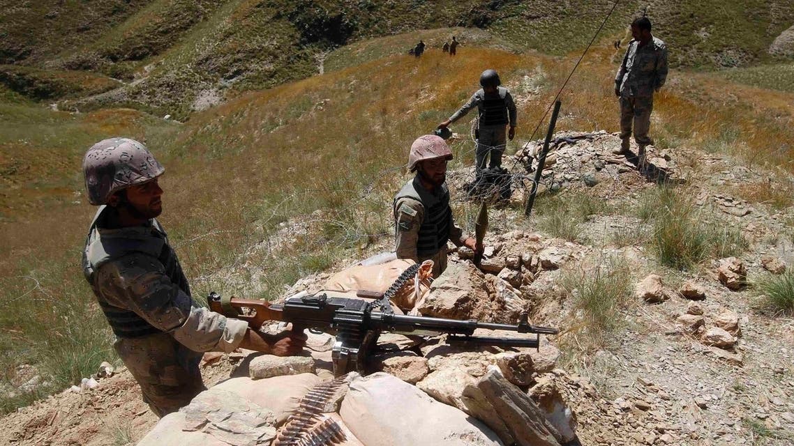 Afghan border policemen take their positions at the Goshta district of Nangarhar province border, where Afghanistan shares borders with Pakistan, May 2, 2013. (Reuters)