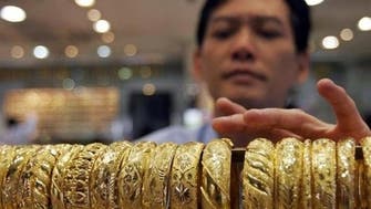 Gold prices hold near two-week high in Singapore