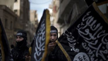 Members of Liwa Hamzah, an Islamist brigade hold flags of Jabhat al-Nusra. AFP photo