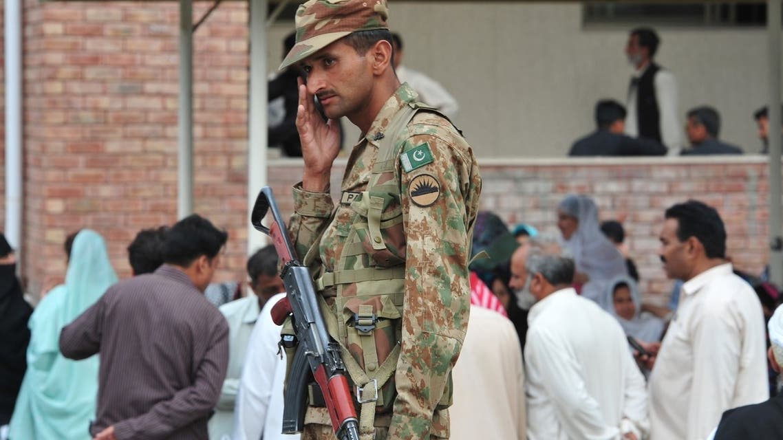 A Pakistani army soldier stands guard at the election material distribution point in Rawalpindi on May 10, 2013. (AFP)