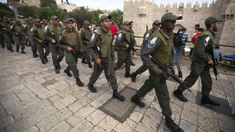 Israeli police guard women praying at Jewish site
