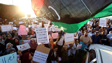 Hundreds of Libyans demonstrate outside the foreign ministry to demand the lifting of the siege by armed gunmen and the return of the rule of law during a protest in Tripoli on May 10, 2013. (AFP)