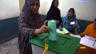A Pakistani woman casts her vote at a polling station in Islamabad. (AFP)