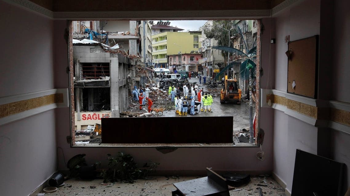 One of the scenes of the twin car bomb attacks seen through a damaged building in the town of Reyhanli of Hatay province near the Turkish-Syrian border May 12, 2013.
