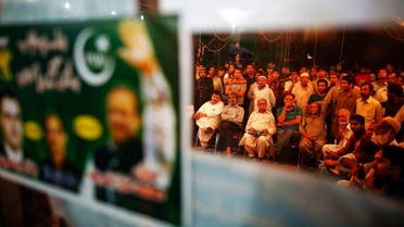 Supporters of the Pakistan Muslim League - Nawaz (PML-N) gather at the party headquarters to watch news after polling stations closed on election day in Lahore May 11, 2013. (Reuters)