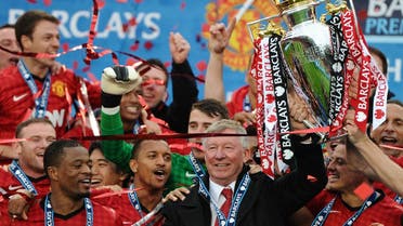 Manchester United’s outgoing manager Alex Ferguson lifts the trophy as the EPL season draws to a close. The winner of the Middle East broadcast rights is yet to be decided. (AFP)