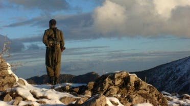 A Kurdistan Workers' Party fighter stands watch in the mountainous region in Turkey on the Iraqi border, May 9, 2013 (Firat New Agency /AFP, -)