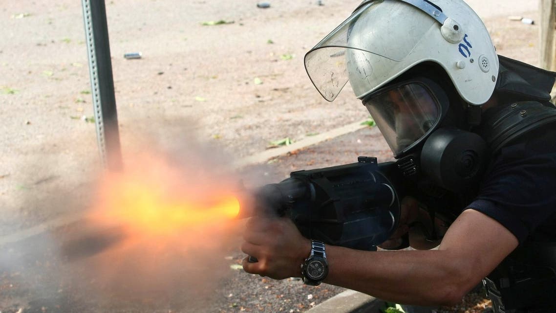 A Turkish policeman fires tear gas at demonstrating students in Ankara on May 15, 2013 who had gathered to protest against government policies they say resulted in last weekend's deadly twin bombings. (AFP)