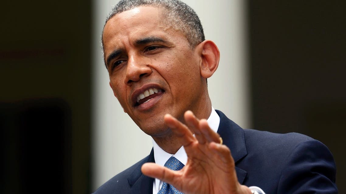 U.S. President Barack Obama answers a question in the rain during a joint news conference with Turkish Prime Minister Recep Tayyip Erdogan in the White House Rose Garden in Washington, May 16, 2013. (REUTERS)