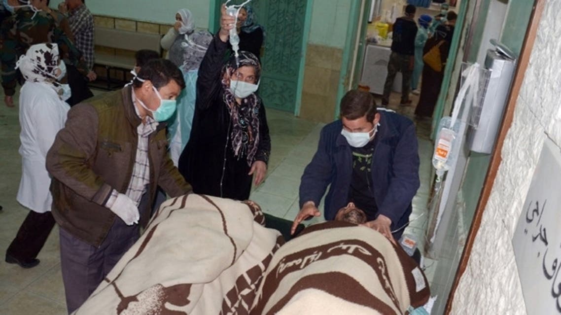People are brought into a hospital in the Khan al-Assal region in the northern Aleppo province, as Syria's government accused rebel forces of using chemical weapons for the first time on March 19, 2013. (File photo: AFP)